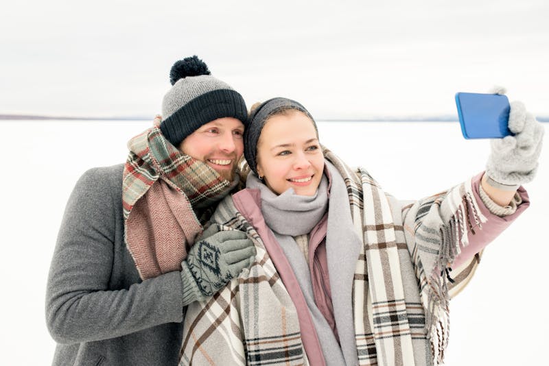 a couple taking a selfie in the snow
